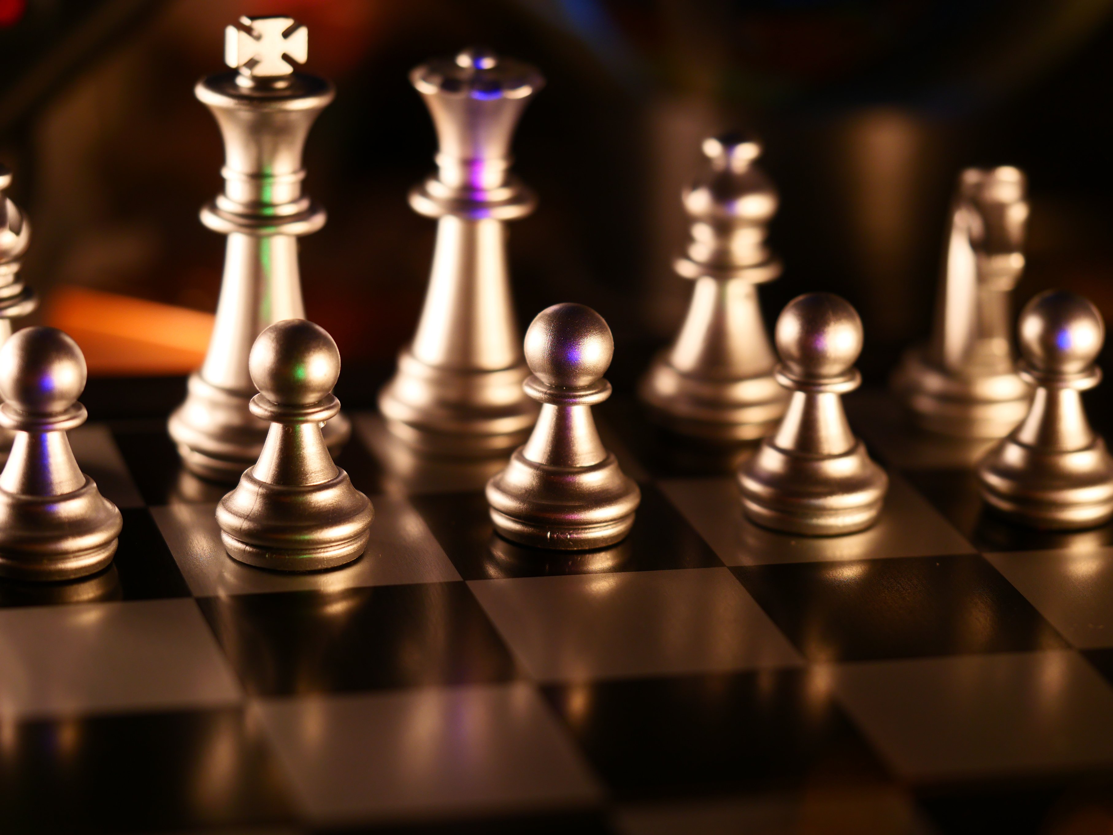 Golden Chess Pieces in Close Up Photography